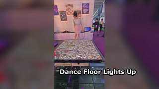 An interactive floor display panel integrated into the interior, featuring a sensor chip.